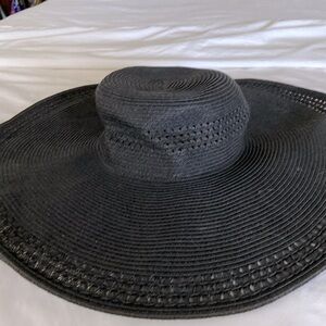 Another wonderful beach hat!  Woven.  Great shape.  Stunning with smart bikini!!
